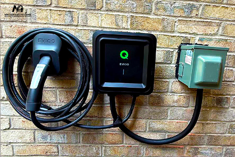 Level 2 EV charger installation in residential garage by professional electrician